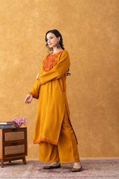 mustard colour pheran, mustard pheran, mustard colour embroidery, mustard yellow embroidered fabric, mustard with red suit set, mustard with red suit set party wear, women mustard with red suit set, mustard with red suit set ladies, mustard with red suit set online, winter suits, winter suits for women, kashmiri winter suits for ladies, kashmiri winter suits for ladies with price, winter suits unstitched, winter woolen suits for ladies with price, unstitched winter suits for ladies